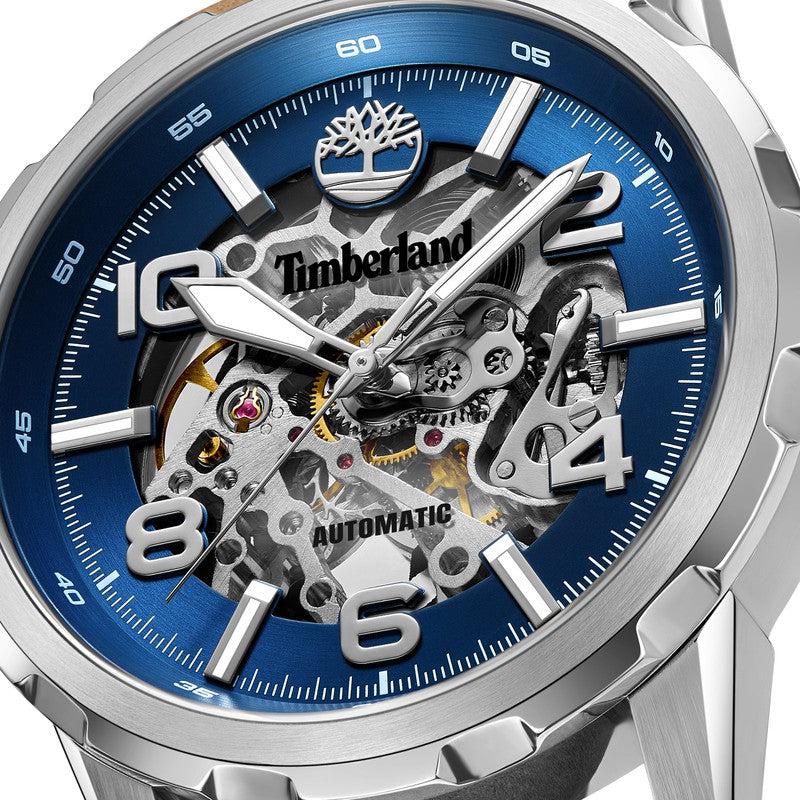 Timberland Montville 46mm automatic watch featuring a blue skeleton dial, stainless steel case, and tan leather strap.